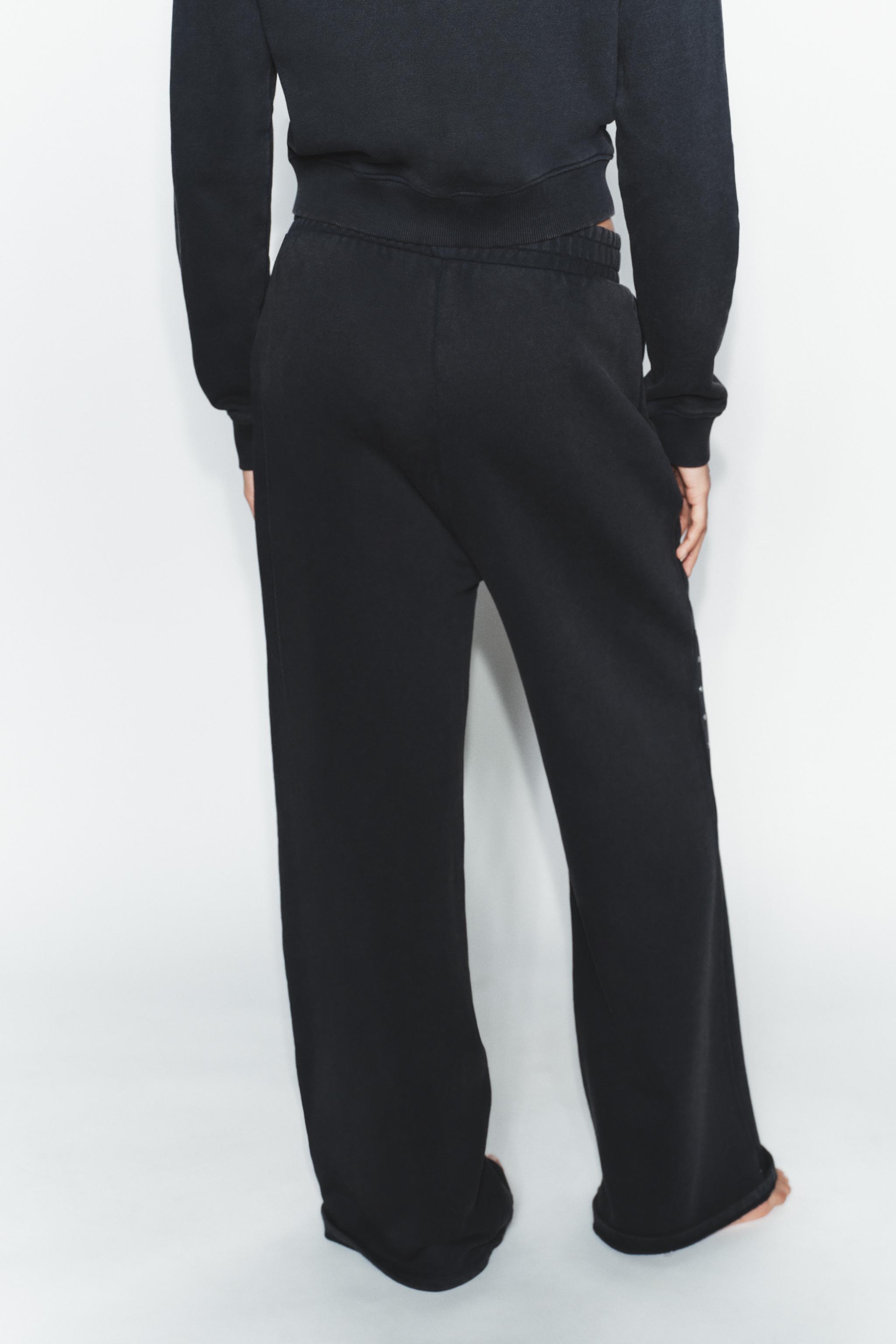 WASHED EFFECT FLEECE PANTS WITH STUDS